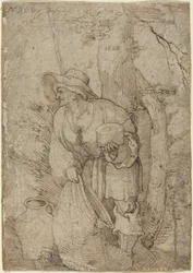 Vieil homme debout sous un arbre