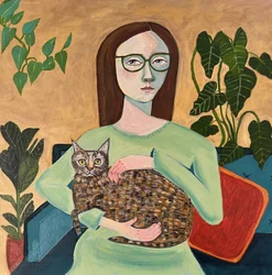 Une femme au chaud avec son chat