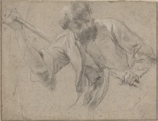 Un homme barbu avec un bâton