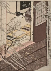 Une femme assise à un bureau regardant la pluie