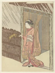 Fille avec une branche de yamabuki en main