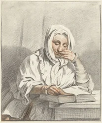 Jeune femme lisant à une table