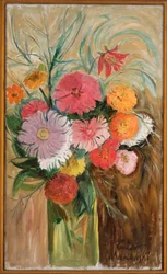 Zinnias et asters dans un bocal en verre