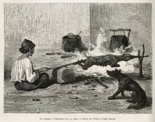 Un jeune Monténégrin faisant rôtir un mouton avec l