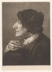 Homme avec des lunettes à la main
