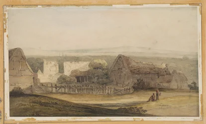 Un vaste bâtiment avec des dépendances agricoles et les ruines d