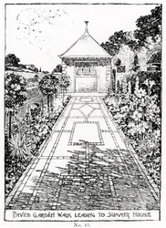 Promenade de jardin pavée menant à la maison d