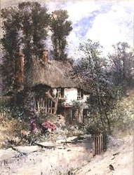 Un cottage au toit de chaume en été