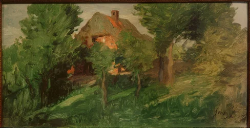 Maison rouge derrière les arbres