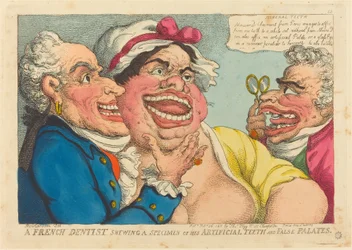 Un dentiste français montrant un spécimen de ses dents artificielles et faux palais