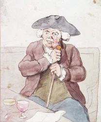 Un homme assis dans une taverne