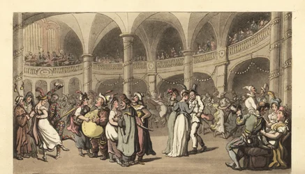 Fêtards en costume à un bal masqué dans un grand théâtre