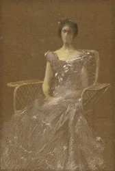 Dame dans un fauteuil en rotin