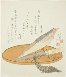 Racine de wasabi avec bonite séchée et couteau sur un plateau laqué
