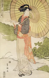 Femme debout avec un parasol