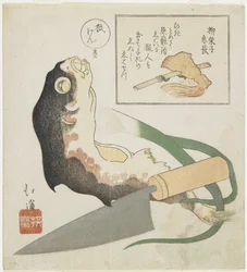 (Poisson-globe, poireau et couteau de cuisine)