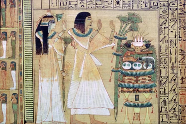 Un homme et sa femme faisant des offrandes à Osiris, du Livre des Morts égyptien