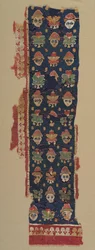 Bordure de têtes et palmettes d