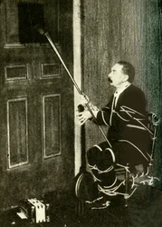 John Nevil Maskelyne réalise une illusion de cabinet spirite, vers 1910