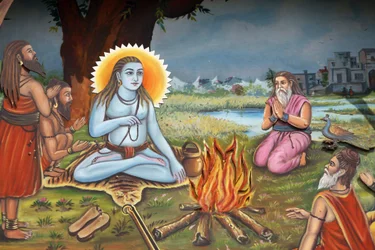 Peinture représentant un homme saint (assis sur une peau de tigre comme Shiva) entouré de disciples, Haridwar, Inde