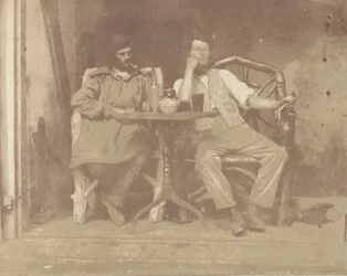 Deux hommes assis à une table, années 1850