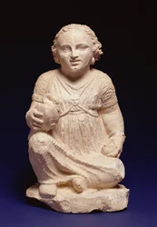 Une fille assise avec un cygne, Chypriote, vers 200 av. J.-C. (calcaire et pigment)
