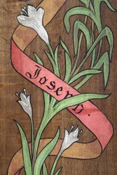 Dessin. Fleurs et un ruban avec le nom Joseph écrit dessus