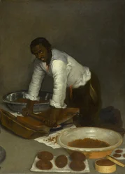 Un homme grattant du chocolat