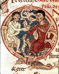 Un serviteur servant à boire au seigneur Miniature du « Lectionnaire de la Cathédrale de Reims » XIe siècle