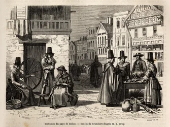 Une rue au Pays de Galles, avec des habitants vêtus de costumes traditionnels, et des activités quotidiennes : une famille et des femmes filant la laine avec des rouets. Gravure pour illustrer un voyage au Pays de Galles, en 1862, par Alfred Erny, dans « L