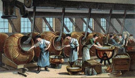 Fabrication mécanique de dragées. Chromolithographie de la fin du XIXe siècle
