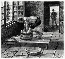 Travail de la tomme par un fromager d