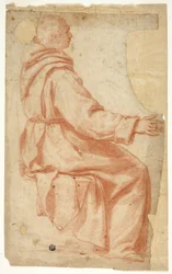 Moine assis de profil à droite