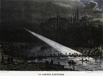 Construction de défenses à travers la Seine la nuit en utilisant la lumière d
