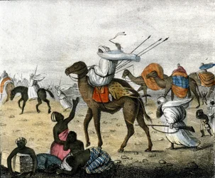 Caravane dans le désert au Maroc pendant une tempête de sable.