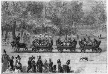 Rails sans fin adaptés à un train de voitures tiré par des chèvres dans le Jardin des Tuileries à Paris.