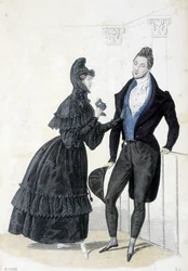 Planche illustrant la mode masculine et féminine des années 1830. La femme porte une robe avec une capuche et tient un masque de bal dans ses mains.