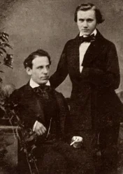 Johannes Brahms (1833-1897) compositeur allemand, debout, avec le violoniste hongrois réfugié, Eduard Remenyi (1828-1898), avec qui il est parti en tournée