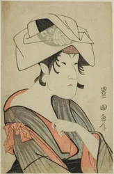 Nakayama Tomisaburo. Habillé en femme avec une serviette sur la tête