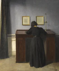 Ida debout à un bureau, 1900