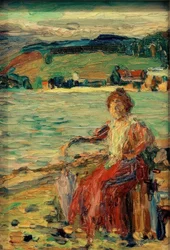 En robe rouge au bord du lac