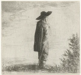 Homme avec chapeau et bâton dans un paysage