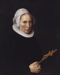 Une dame tenant un crucifix