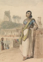 Une femme de haute caste debout près d