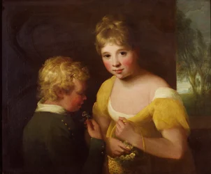Deux enfants avec un panier de fleurs