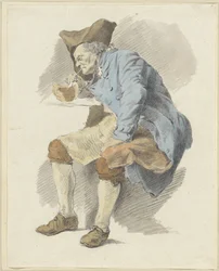 Homme assis allumant sa pipe à une lampe