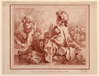Berger assis jouant avec un chien