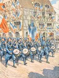 Militaire français victorieux dans un village en Alsace pendant la Première Guerre mondiale